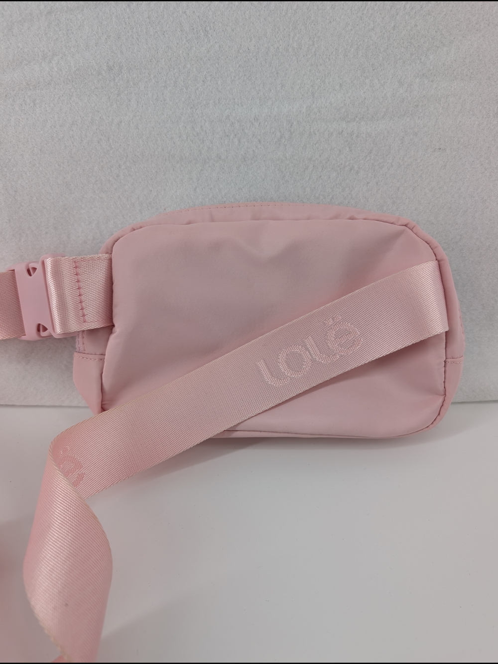 Lolë Jamie Belt Bag in a light pink colorLole Soft Pink Crossbody Waist Bag